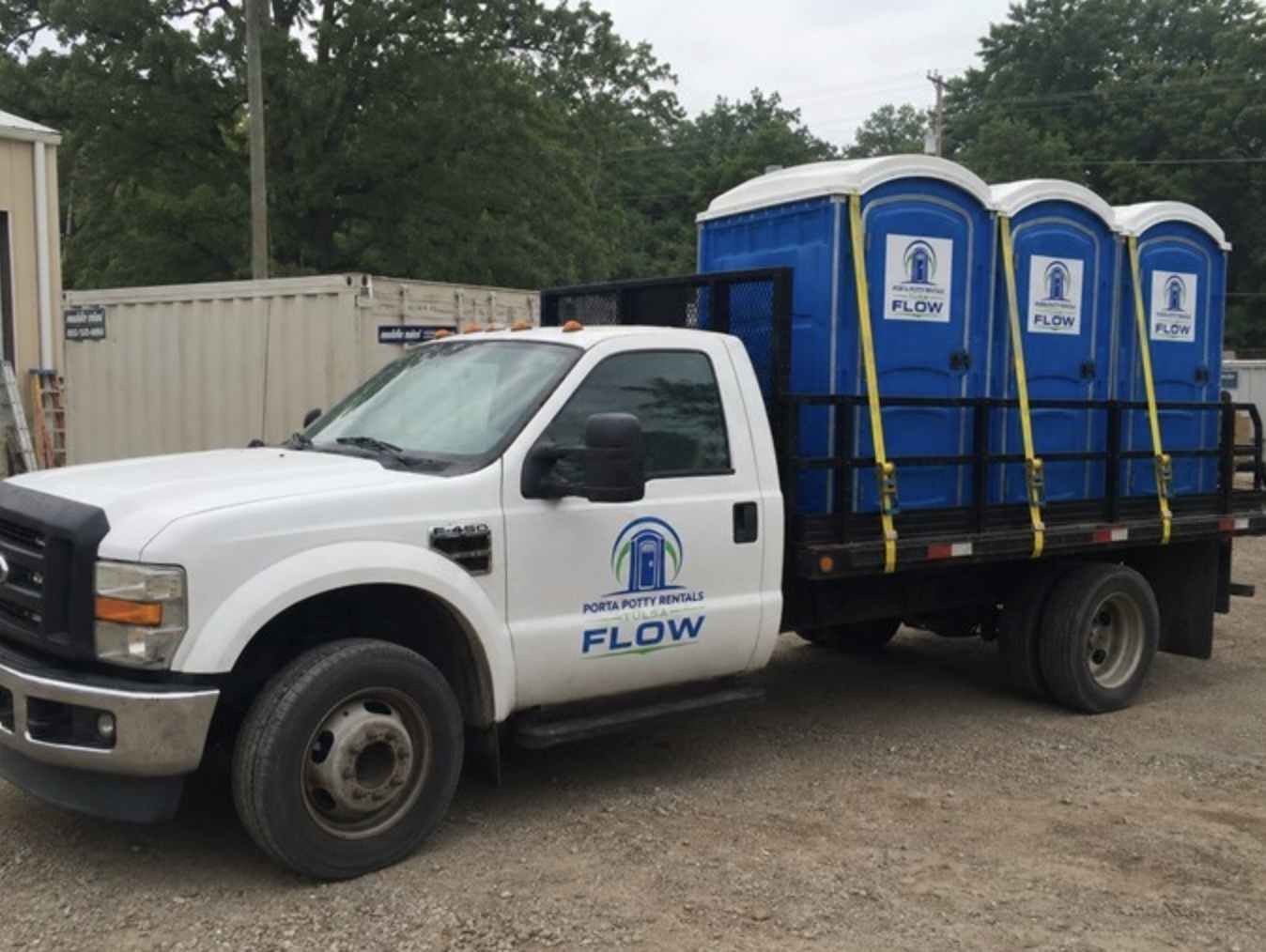 Delivery truck loaded with portable toilets